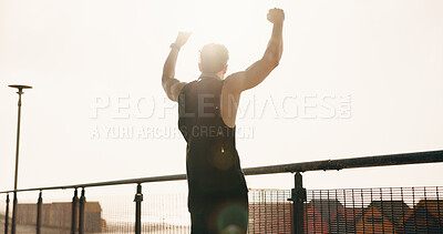 Buy stock photo Athlete, man and cheering for fitness in city for success, exercise achievement and milestone. Back, male person and fist pump for celebration, running goals and winner for sports competition outdoor