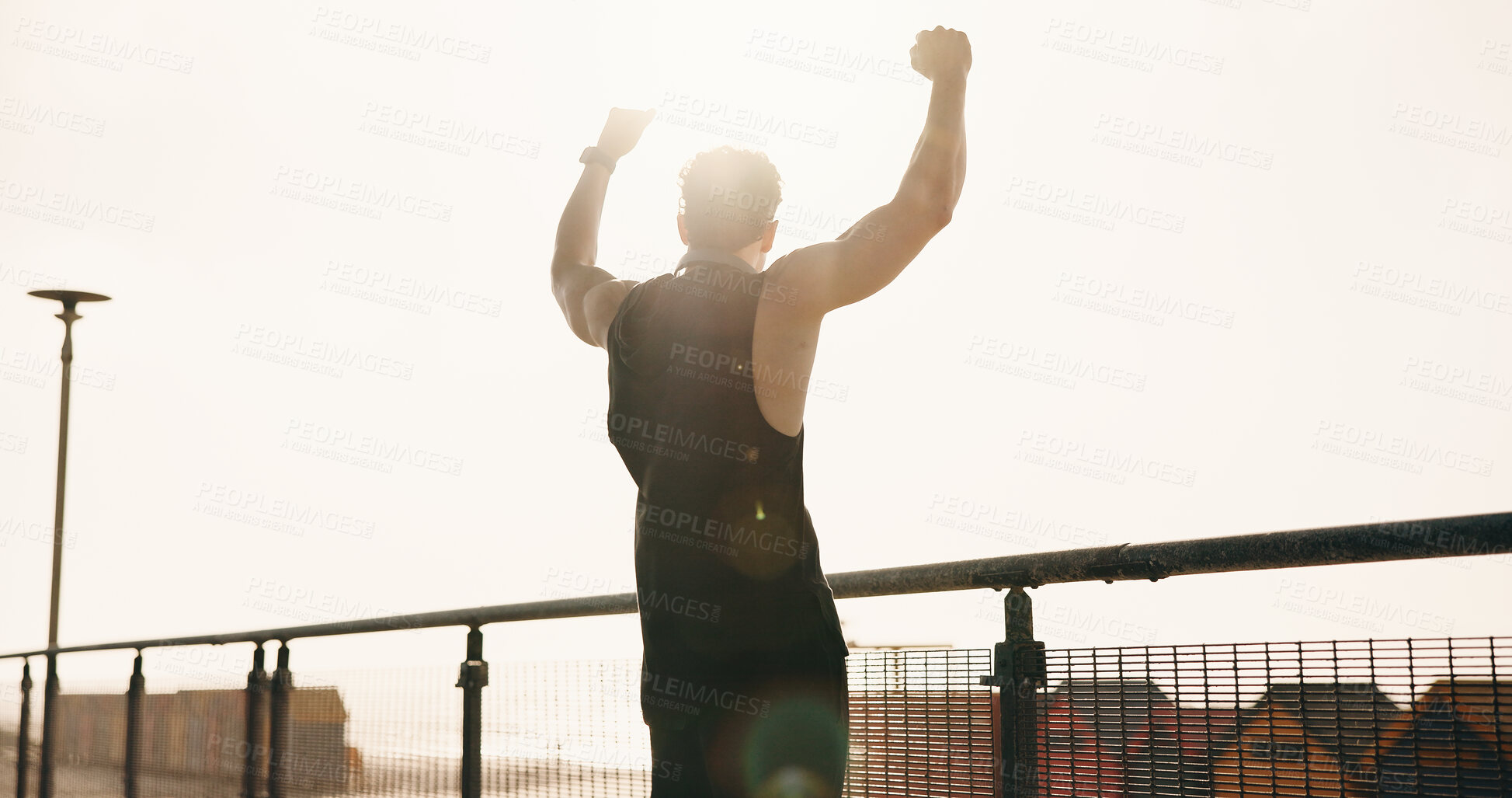 Buy stock photo Athlete, man and cheering for fitness in city for success, exercise achievement and milestone. Back, male person and fist pump for celebration, running goals and winner for sports competition outdoor