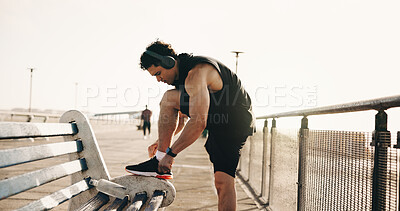 Buy stock photo Exercise, shoelace and man in city, fitness for wellness and comfort for footwear, sunshine and practice. Outdoor, athlete and person with sneakers, workout and shoes for training and start routine