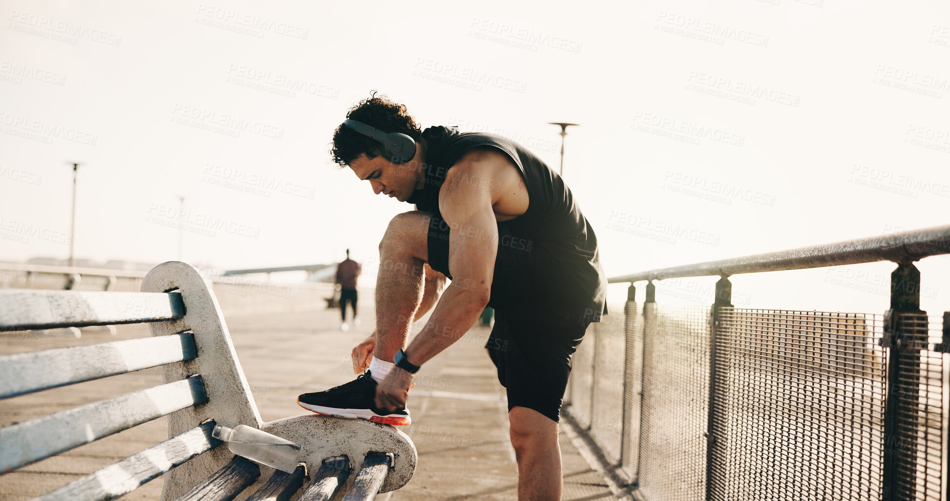Buy stock photo Exercise, shoelace and man in city, fitness for wellness and comfort for footwear, sunshine and practice. Outdoor, athlete and person with sneakers, workout and shoes for training and start routine