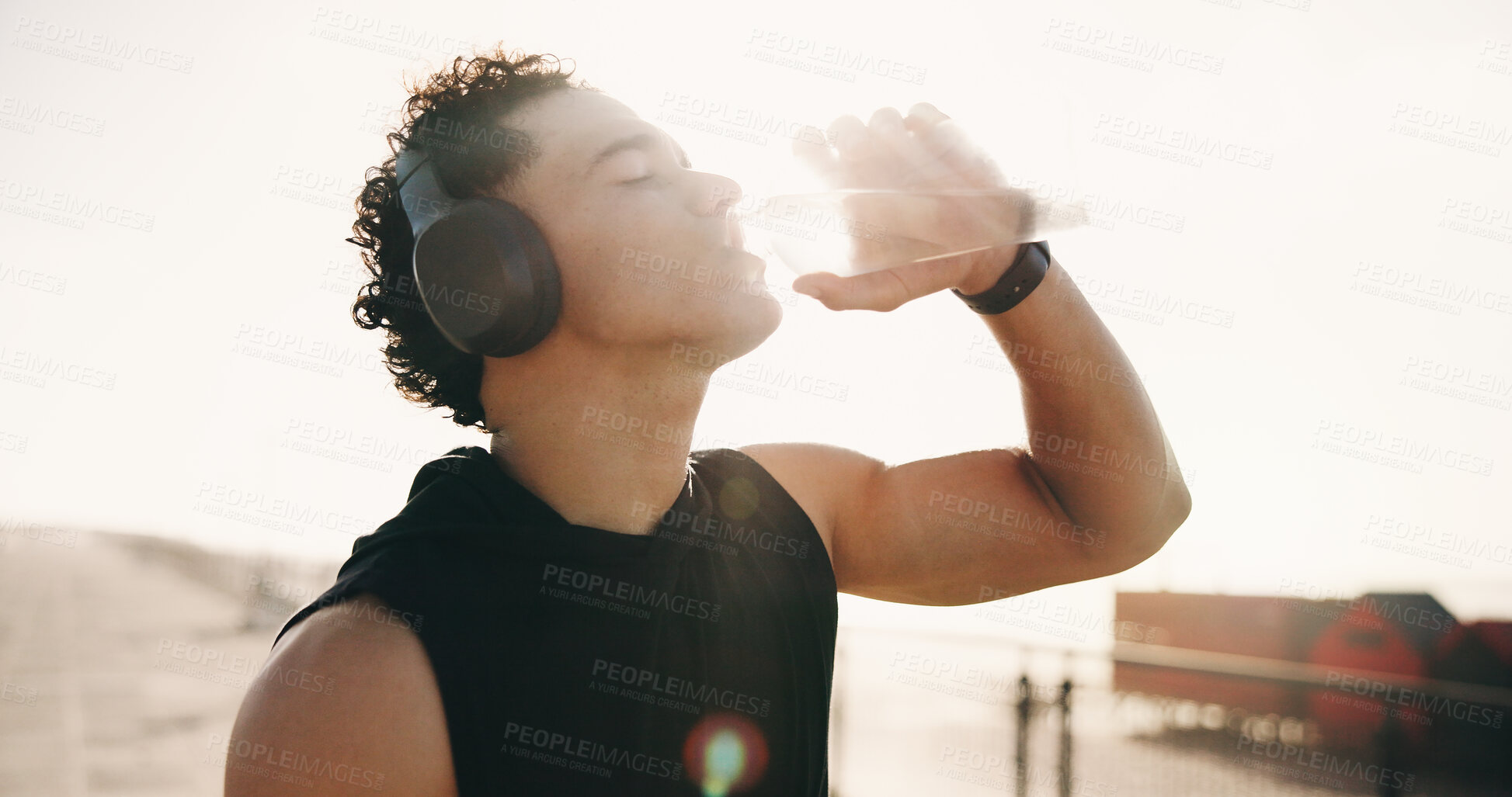 Buy stock photo Fitness, drinking water and man in city, wellness and aqua for hydration, exercise and sunshine. Outdoor, athlete and person with h2o liquid, electrolytes and workout for health benefits or nutrition