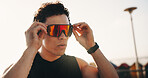 Fitness, outdoor and man with wellness, glasses for uv protection and thinking. Person, exercise and athlete with eyewear for vision, workout and polarized lenses for sight,  reflection and fashion