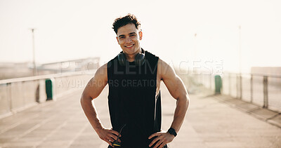 Buy stock photo Runner, portrait and happy man in city for fitness, break and confident for wellness after exercise. Outdoor, athlete and person with smile for health, resting and training with headphones and space