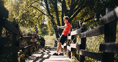 Buy stock photo Bridge, smart watch and man with fitness, rest and digital app to track progress. Health stats, runner and person in nature, check time and results for challenge, heart rate and performance monitor