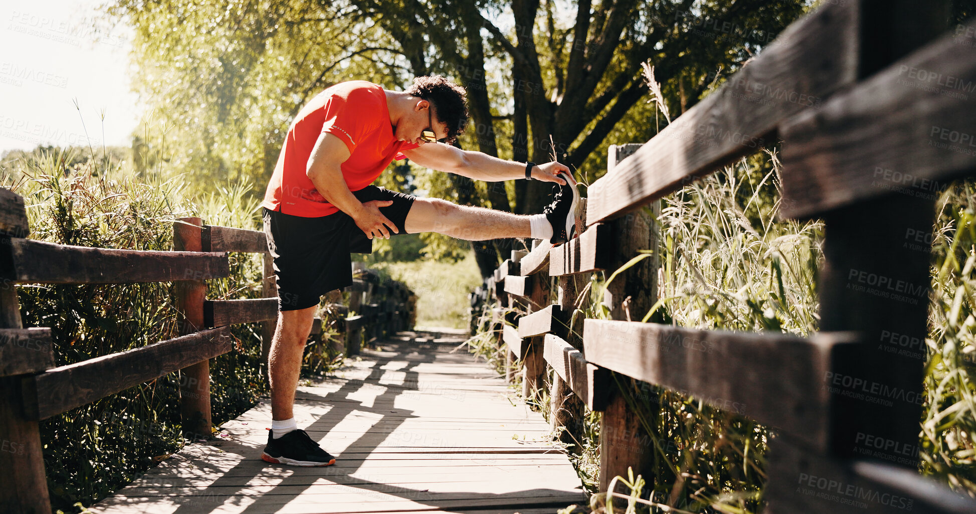 Buy stock photo Stretching, legs and man in nature for fitness, exercise and training for cardio workout. Runner, athlete and person with warm up for endurance, mobility and wellness for active hobby outdoor