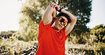 Stretching, arms and man in nature for exercise, workout and training for cardio, health and wellness. Athlete, runner and person in park warm up for active hobby, practice and challenge for fitness