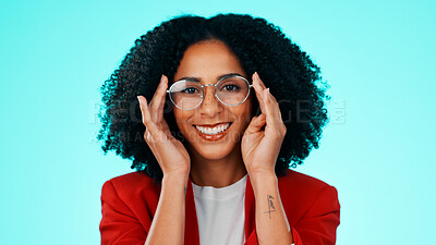 Buy stock photo Portrait, businesswoman and glasses for eye care in studio, optometry or smile with frame for vision. Blue background, person and eyewear for eyesight, happy and prescription lens in Puerto Rico