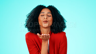 Buy stock photo Woman, love and blow kiss in studio for romance, flirting and expression on blue background. Happy person, space and kissing air with hand gesture for emoji, reaction and date on valentines day