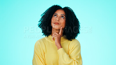 Buy stock photo Thinking, wonder and woman in studio, decision and contemplation on blue background. Reflection, unsure and person with choice, thoughtful and looking up for doubt, confused and ponder with questions