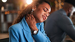 Woman, neck pain and stress at night in office with injury, sore muscle or strain with fatigue at company. Person, frustrated and exhausted with burnout, joint ache and overtime at creative agency