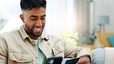 Buy stock photo Credit card, phone and man in home for payment, investment or online shopping in living room. Mobile, sofa and happy person with debit for digital money, internet banking or financial purchase