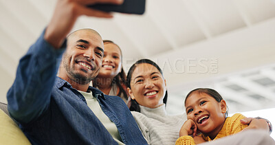 Buy stock photo Selfie, family and girls in home, smile and bonding together for love, care and funny. Apartment, parents and mother with father, daughters or profile picture to capture moment, laughing or low angle