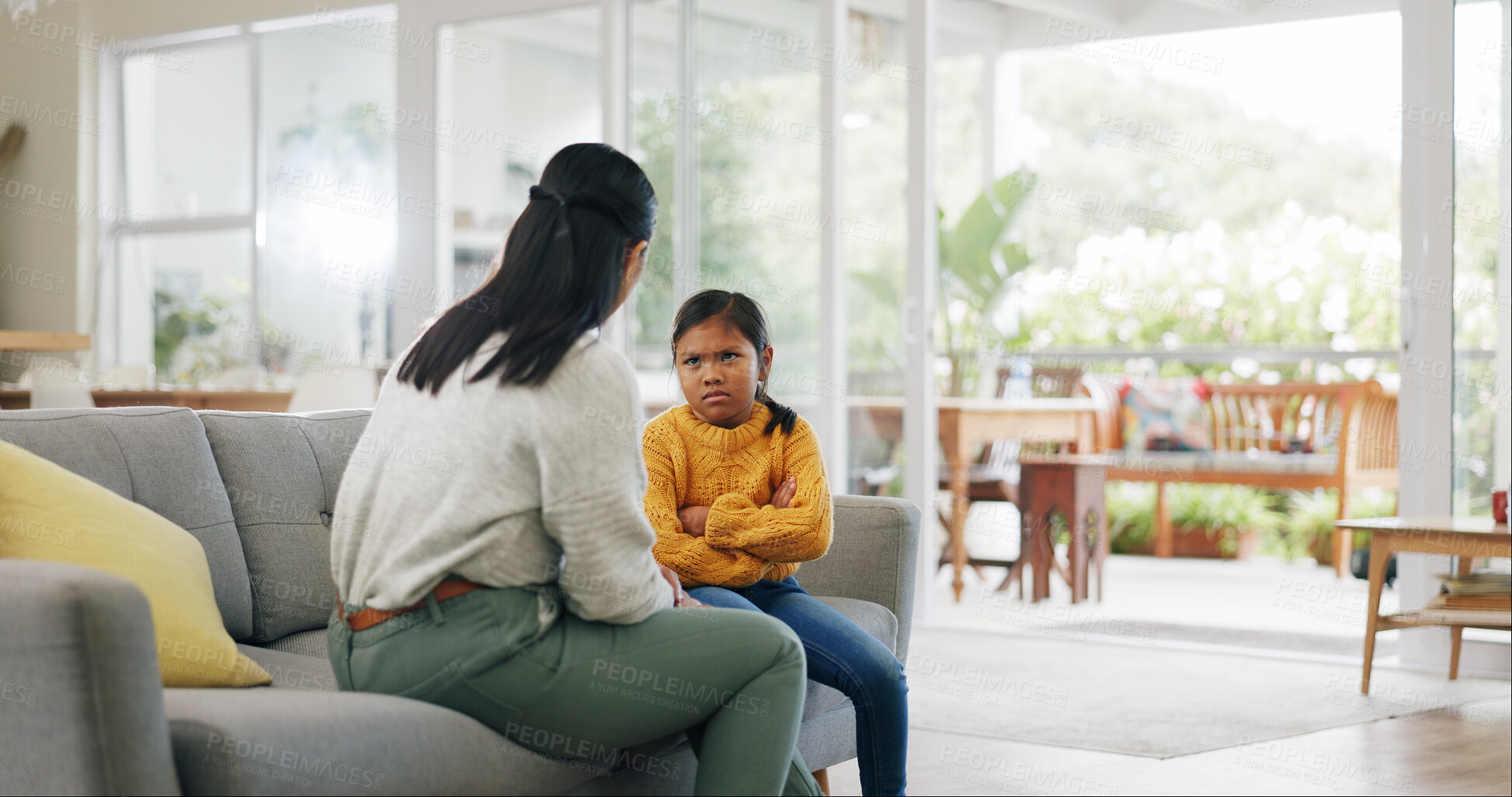 Buy stock photo Talking, discipline and mom with child on sofa for behavior, tantrum and bad attitude in home. Parenting, family and mother with girl in lecture, discussion and scold for rules, conflict and naughty