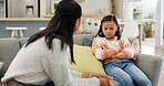 Listening, discipline and mom with girl on sofa for behavior, trouble and bad attitude in home. Parenting, family and mother with child in lecture, discussion and scold for rules, conflict or dispute