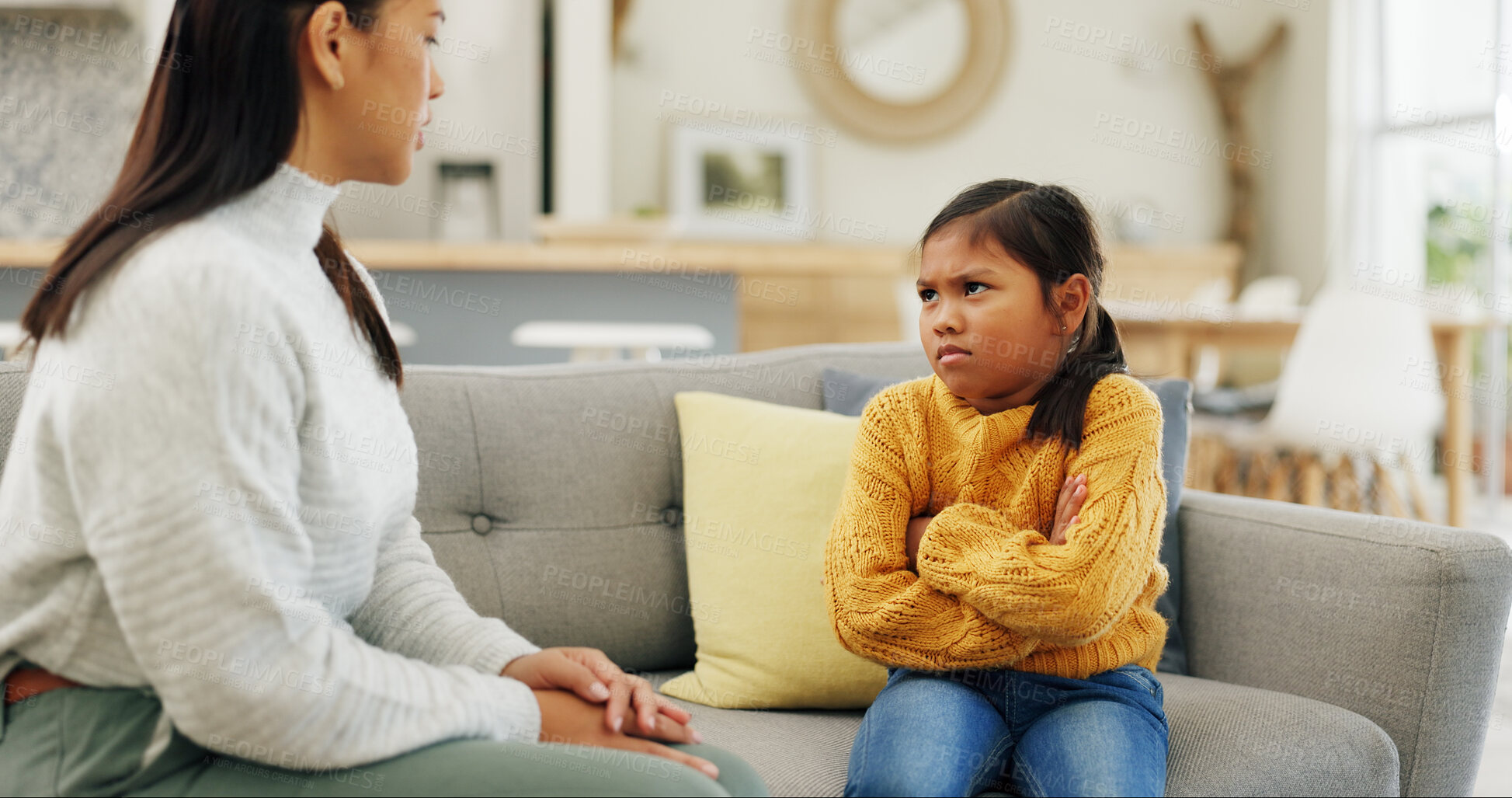 Buy stock photo Angry, discipline and mother with child on sofa for behavior, tantrum and bad attitude in home. Crossed arms, family and mom with girl for lecture, talking and scold for rules, conflict and parenting