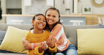 Happy, hug and portrait of sisters on sofa for bonding, relationship and affection for trust in home. Family, siblings and girls with smile and embrace for love, support and care in living room
