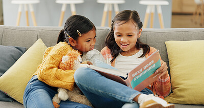 Buy stock photo Reading book, sisters and girls in home, smile and education for language development. Apartment, siblings and children on couch, storytelling and learning for growth, knowledge and happiness