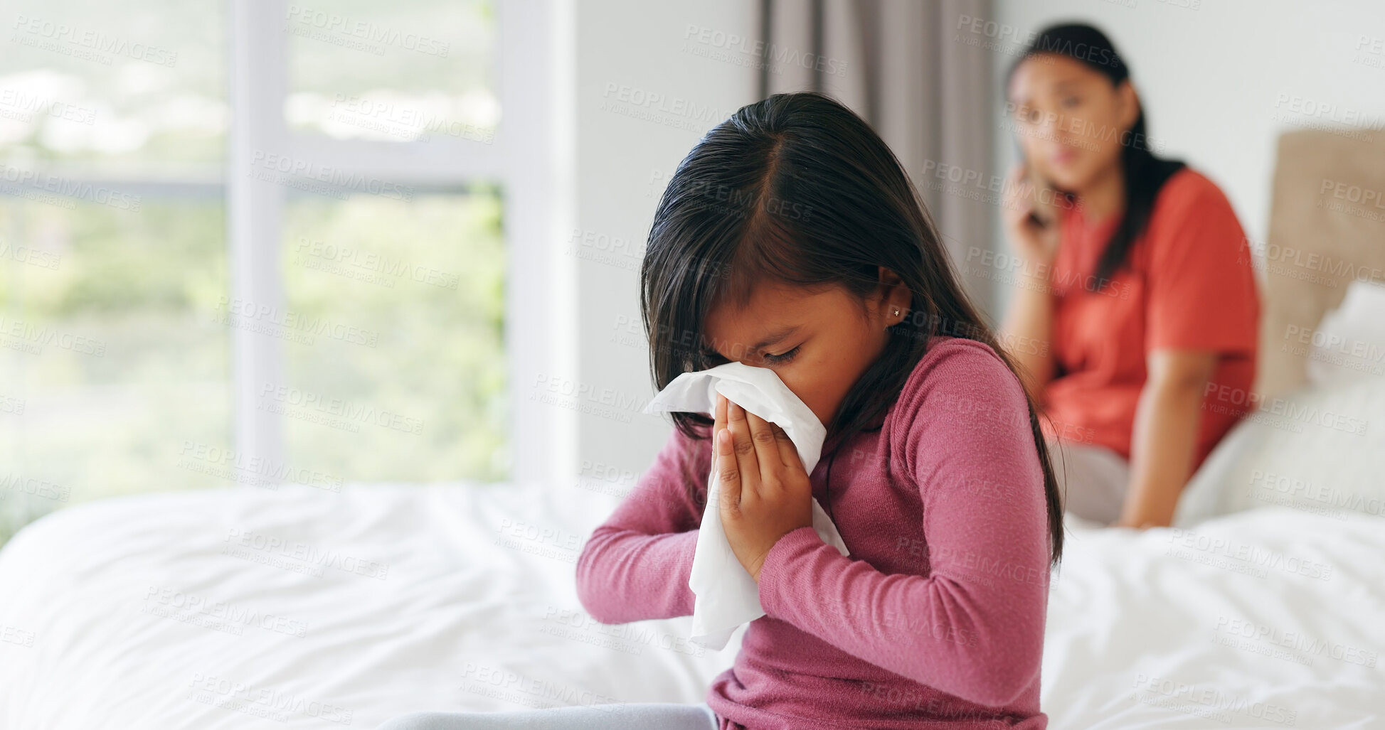 Buy stock photo Health, sneezing and tissue with girl in bedroom of home for sinus infection or virus. Cold, flu and blowing nose with mom on phone call for sick daughter, appointment or checkup in apartment