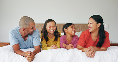 Buy stock photo Happy family, parents and kids relax on bed, bonding together and laughing with care in morning. Children, mother and father in bedroom at home with funny joke, connection and love in apartment