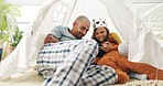 Tent, tablet and father with child in home for watching movie, film or show with family bonding. Technology, crown and dad with girl kid for streaming comedy series together with online subscription.