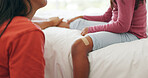 Mother, daughter and bandage in home with knee injury, first aid assistance and wound from accident. Woman, child and help in bedroom with plaster, bruise and healing support for hurt leg in house.