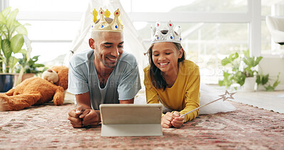 Buy stock photo Crown, dad or girl on floor with tablet, cartoon streaming or bonding together with movie binge. Tech, man or child in house with costume, multimedia subscription or parent connection in living room.