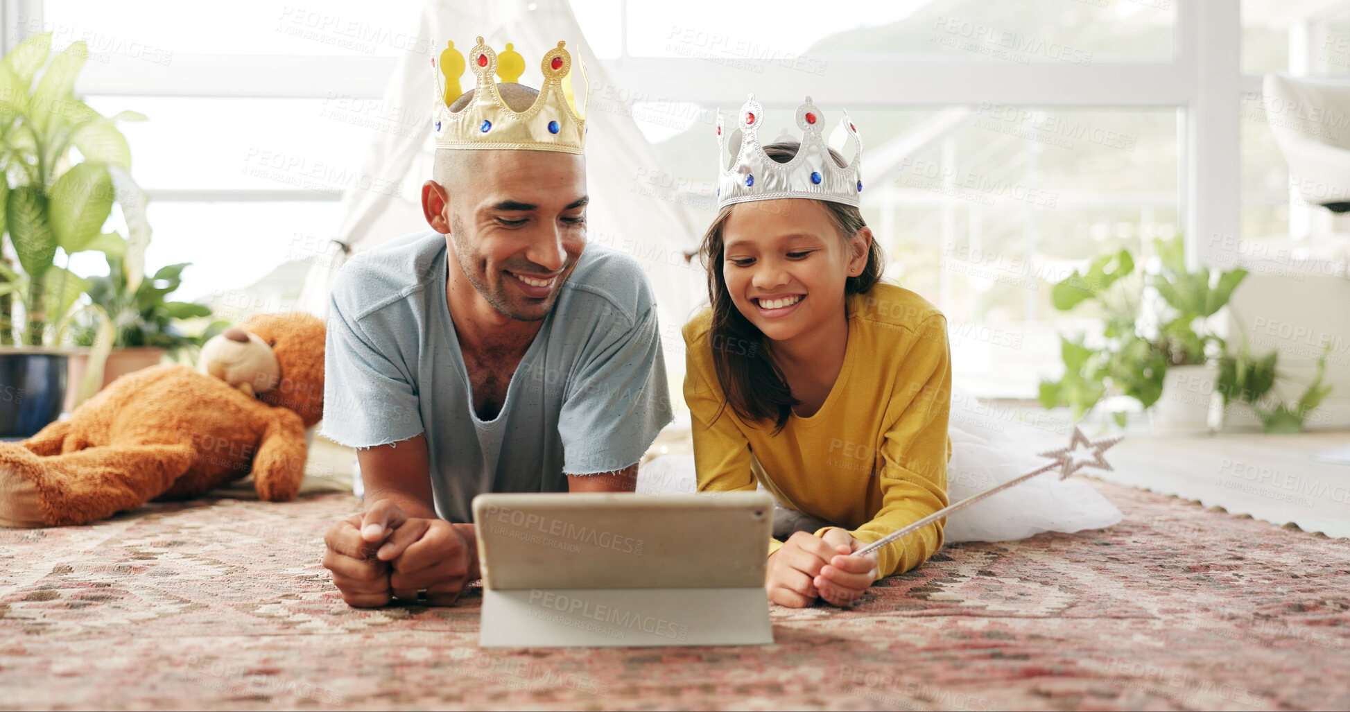 Buy stock photo Crown, dad or girl on floor with tablet, cartoon streaming or bonding together with movie binge. Tech, man or child in house with costume, multimedia subscription or parent connection in living room.