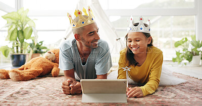 Buy stock photo Crown, dad or kid on floor with tablet, cartoon streaming or bonding together with movie binge. Tech, man or child in house with costume, multimedia subscription or parent connection in living room.