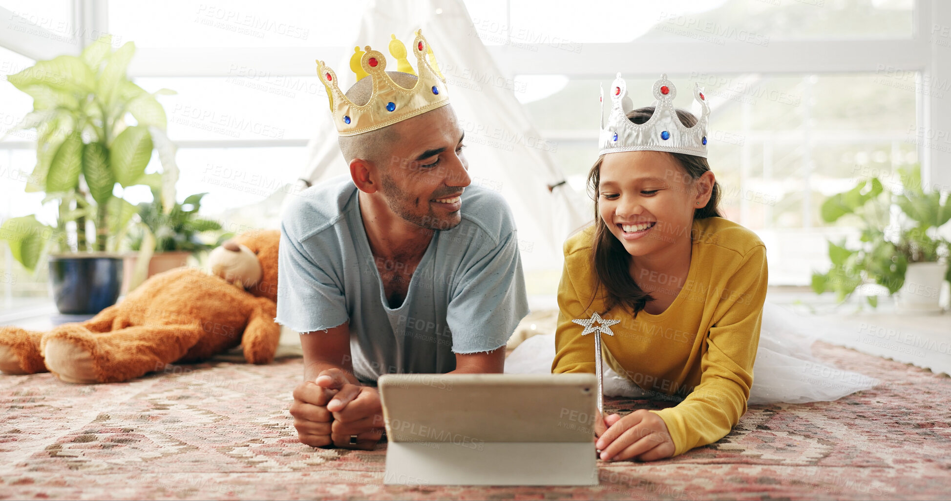 Buy stock photo Crown, dad or kid on floor with tablet, cartoon streaming or bonding together with movie binge. Tech, man or child in house with costume, multimedia subscription or parent connection in living room.