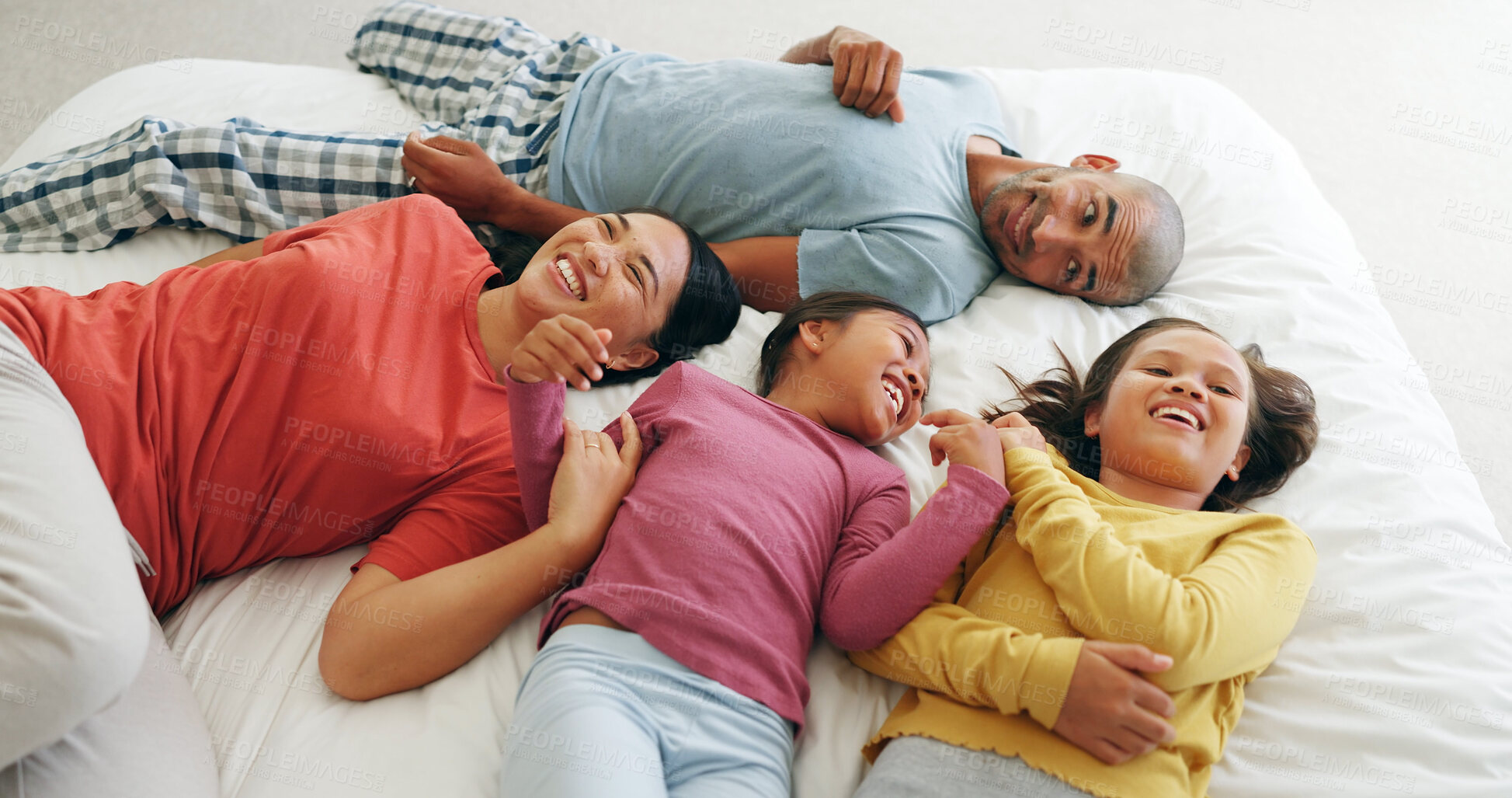 Buy stock photo Above, parents or girls on bed with love, childcare or healthy relationship on weekend break. Happy, people or children in house with bonding, parenthood or family connection in childhood development