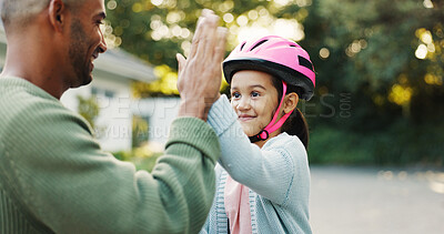 Buy stock photo Bike, learning and father with girl, high five for support and child development with smile. Parent, outdoor and dad with daughter, gesture for growth and teaching with celebration for goal or safety