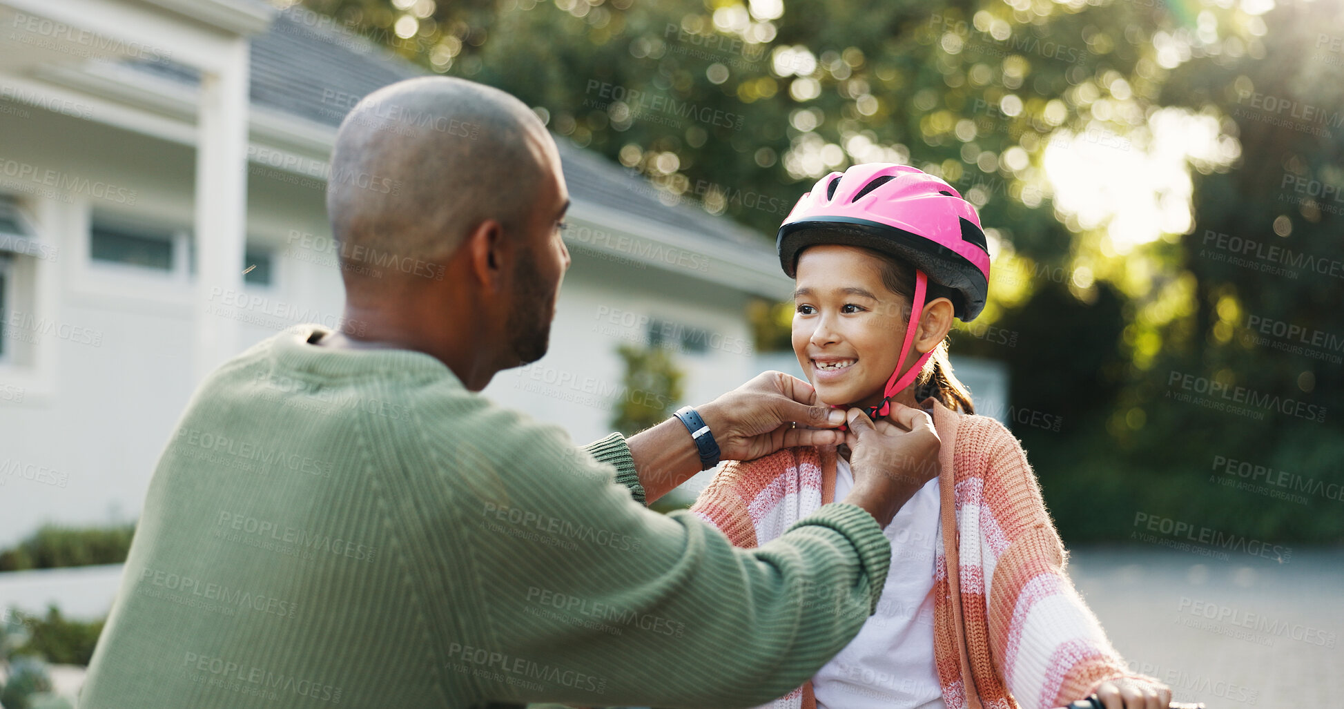 Buy stock photo Development, helmet and father teaching daughter how to ride bicycle outdoor in front of home. Protection, safety and smile of girl child with single parent man in driveway for cycling or learning