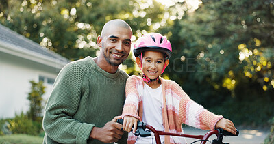 Buy stock photo Bicycle, portrait and father teaching daughter how to ride outdoor in front of home for safety. Development, helmet and smile of girl child with single parent man in driveway for cycling or learning