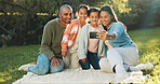 Selfie, mother and father with kids on picnic blanket for social media post, vacation and relax. Parents, children and family photo on grass for holiday, happy memory and profile picture at park