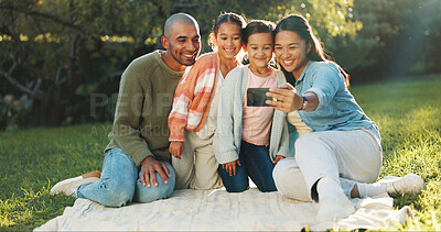 Buy stock photo Selfie, mother and father with kids on picnic blanket for social media post, vacation and relax. Parents, children and family photo on grass for holiday, happy memory and profile picture at park