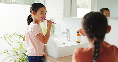 Buy stock photo Kids, dental health and brushing teeth in bathroom for cleaning, self care and fresh breath. Girls, toothbrush and gum wellness in home for oral hygiene, orthodontics and dentistry for development