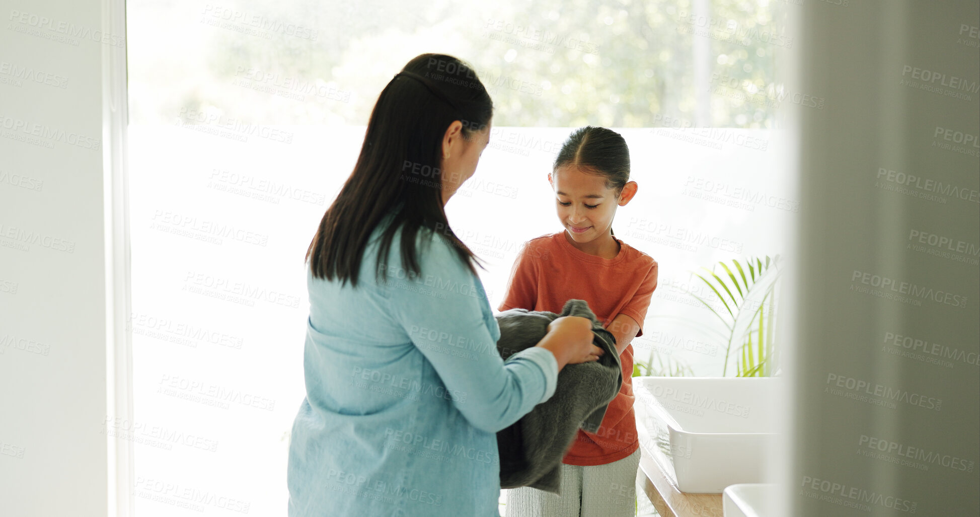 Buy stock photo Mother, child and washing hands with towel for hygiene, cleanliness and bacteria removal. Smile, woman and help with drying palm of kid, sanitation habit and mom guidance for germ prevention at house