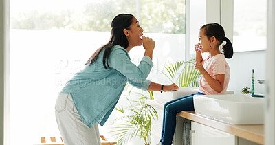 Buy stock photo Mother, girl and brushing teeth in bathroom for learning, oral hygiene and morning routine for bonding. Teaching, woman and child with toothbrush for dental care, cleaning mouth demonstration or home