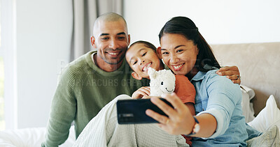 Buy stock photo Happy family, parents and girl with selfie in bedroom, social media post and bonding for cozy weekend. Profile picture update, toy and people with child for photography, support and smile in home