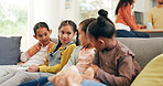 Conversation, girls and friends on sofa, home and bonding together in living room. Kids, youth and group on couch, discussion and share story for gossip, relax and comfort with break and holiday