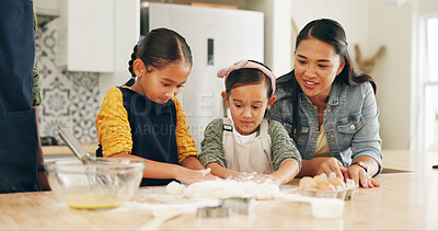 Buy stock photo Baking, family and girls in kitchen, ingredients and bonding together for hobby, dough and skills. Happy, parents and children in home, recipe or meal prep with utensils for cooking, growth and help