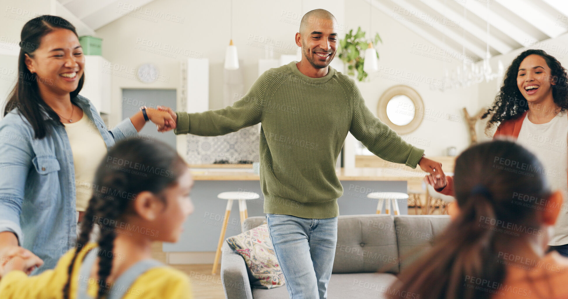 Buy stock photo Family, holding hands and people with dancing in living room, weekend fun and smile for relationship. Connection, parents and children with happiness in home, music and love for bonding together