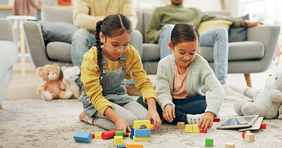 Buy stock photo Building blocks, game and children on floor in home with bonding, connection or growth together. Fun, playing and kids with toys for creative activity with sensory development, skills or education.