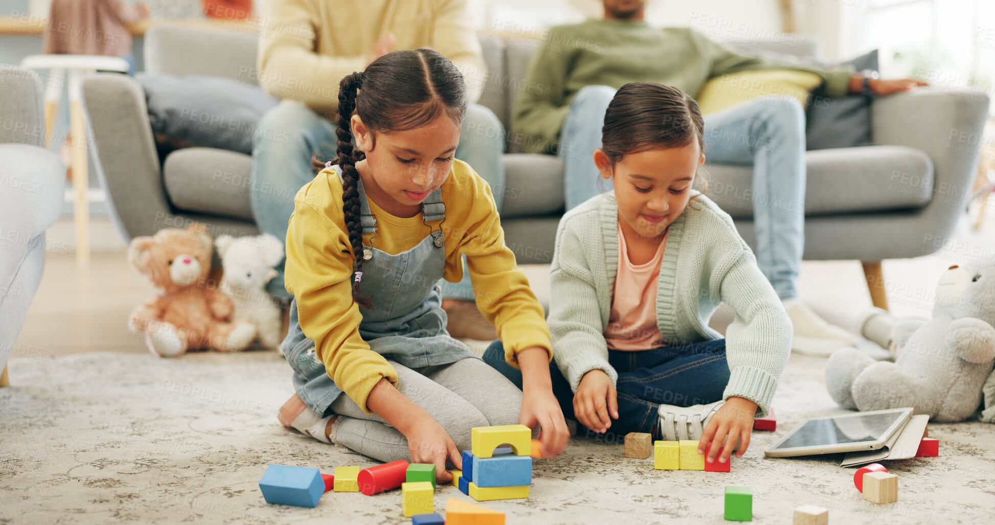 Buy stock photo Building blocks, game and children on floor in home with bonding, connection or growth together. Fun, playing and kids with toys for creative activity with sensory development, skills or education.