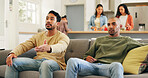 Upset, frustration and men watching sports on sofa in home with losing, bad game or disappointed. Annoyed, sad and male friends streaming football or soccer together in living room at apartment.