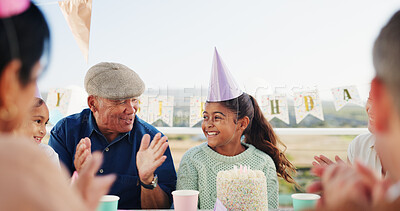 Buy stock photo Grandfather, kid or applause for birthday at patio, bonding together or congratulations with family. Cake, happy girl and clap at party for special day, celebrate or children with generations outdoor