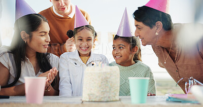 Buy stock photo Happy, family and children at party with birthday cake, clap and love for generations bonding together. People, applause and girls smile outdoor with parents, grandmother and dessert for celebration.