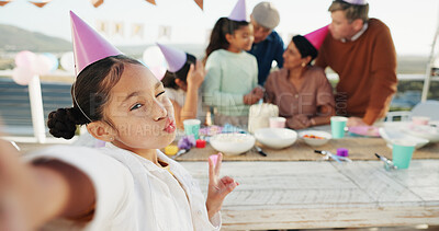 Buy stock photo Child, birthday and portrait with family for selfie, outdoor party or memory together. Girl, peace sign and wink with group picture or photography for capture moment, social gathering or celebration