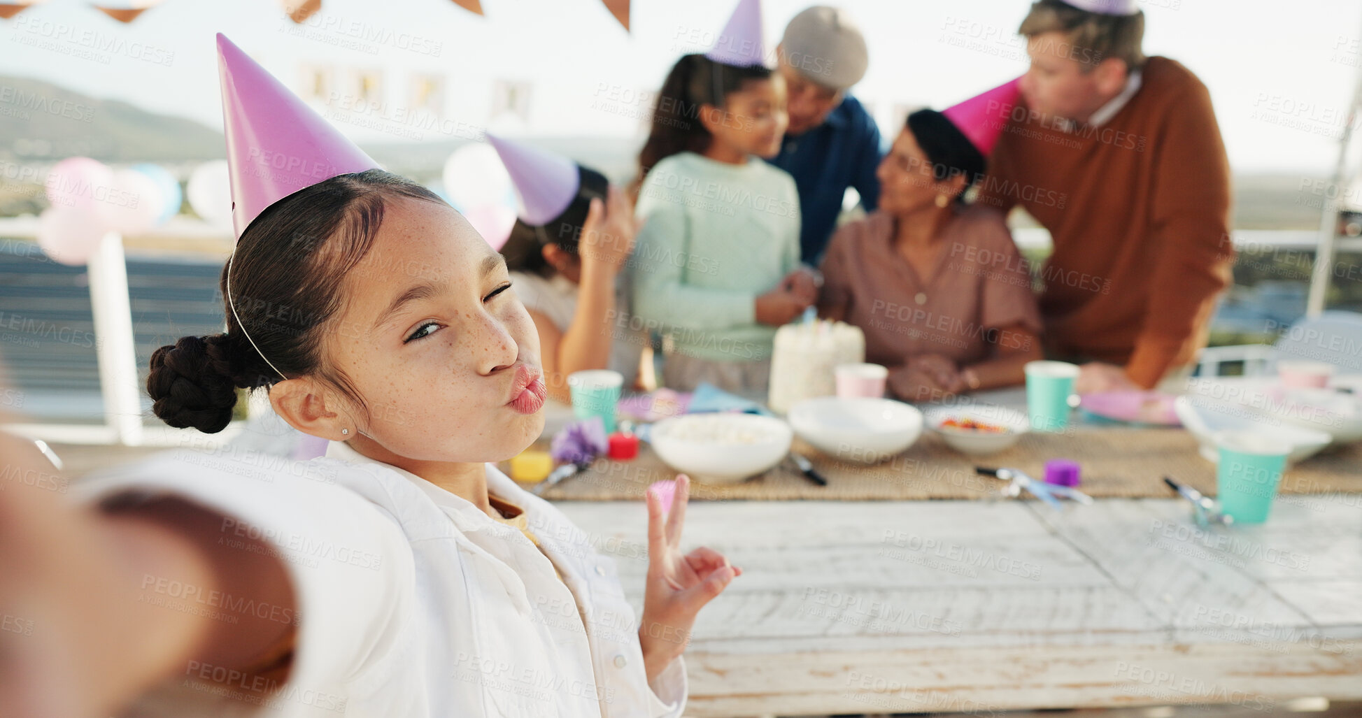 Buy stock photo Child, birthday and portrait with family for selfie, outdoor party or memory together. Girl, peace sign and wink with group picture or photography for capture moment, social gathering or celebration
