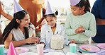 Happy girl, family and applause with birthday party, cake or hat for outdoor celebration together. Excited, child or clapping with smile, dessert or milestone for year, wishing or social gathering